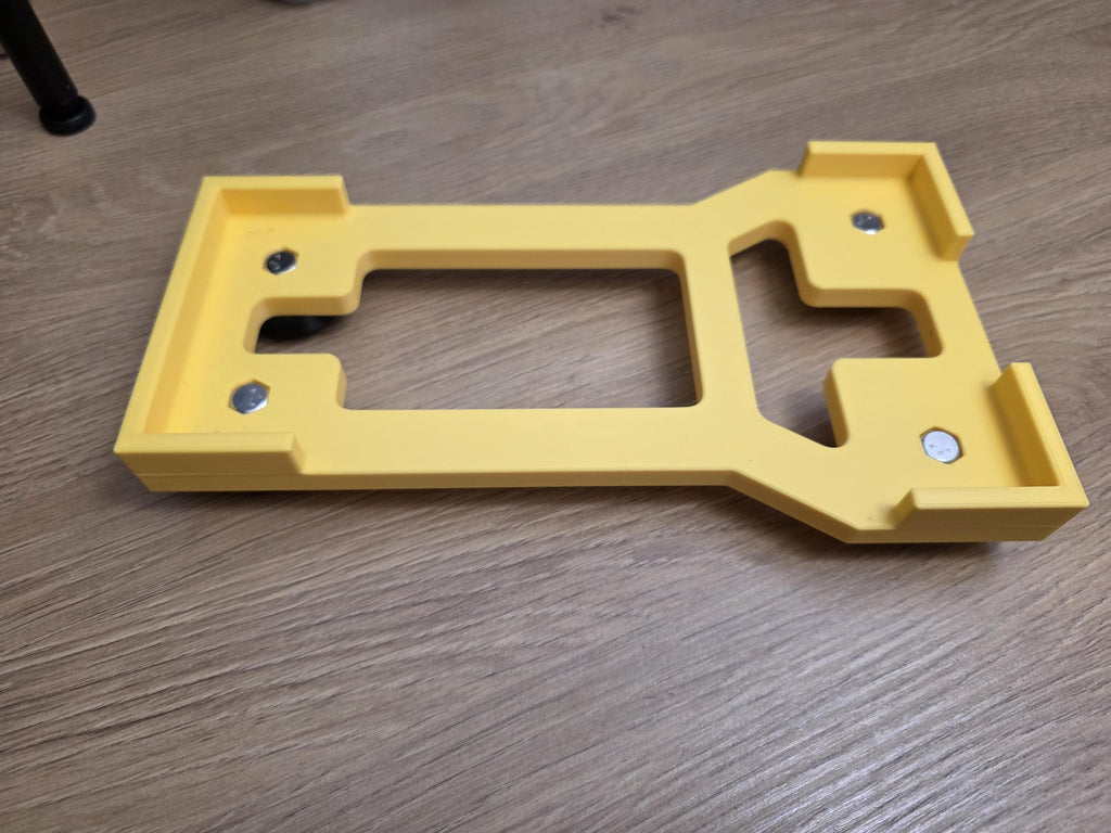 A 3D printed cradle for the Active 2.0 pressure washer power head shown in yellow with included stainless hardware. 
