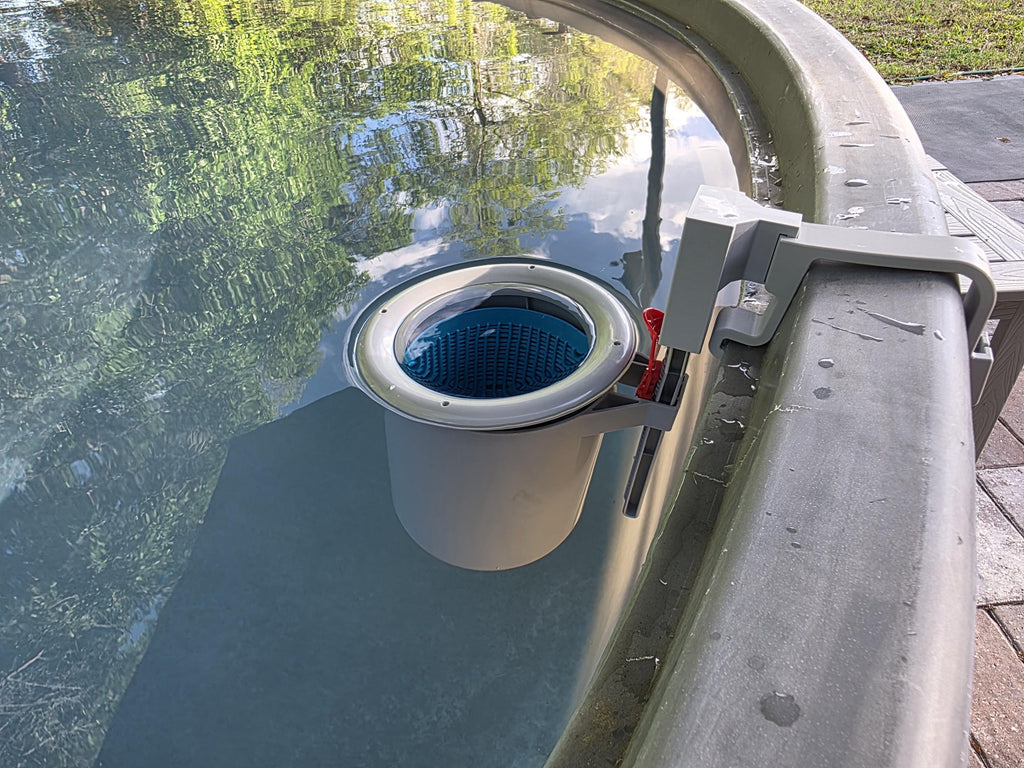 A US Pool Supply above ground pool skimmer installed onto a grey poly stock tank using a grey 3D printed bracket and a grey adapter to the US Pool Supply skimmer support rod. 